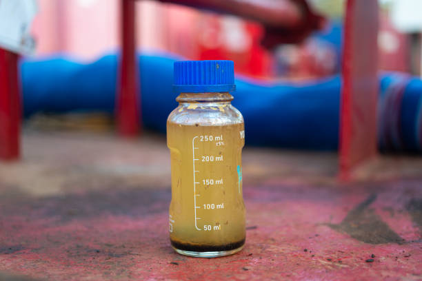Dirty water from industrial process in bottle